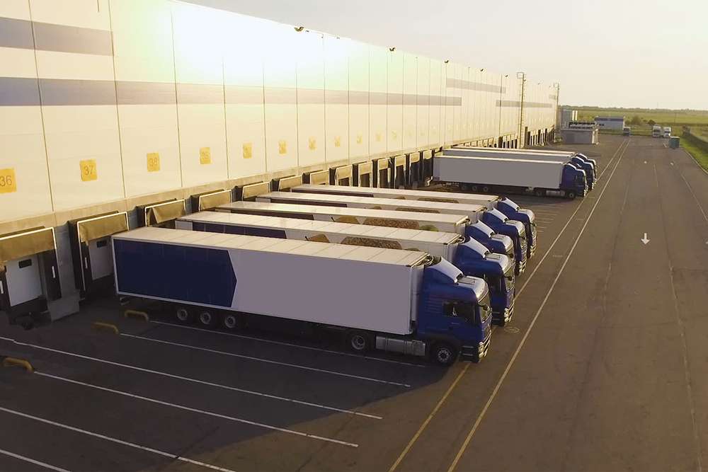 Distribution warehouse with trucks awaiting loading.